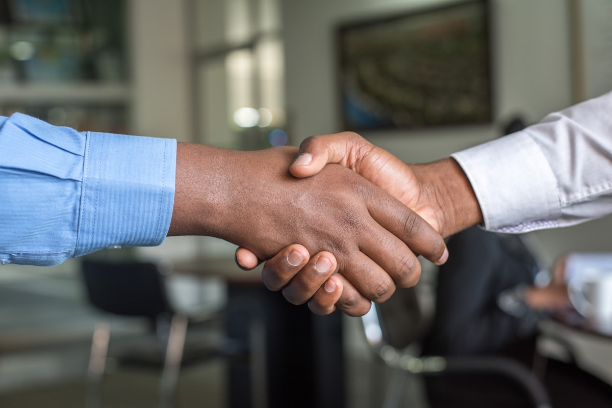 Business executives discussing regulatory compliance strategy